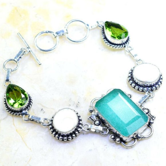 Hand Crafted Jewelry - Handmade Emerald Shiva Shell Peridot Silver Bracel